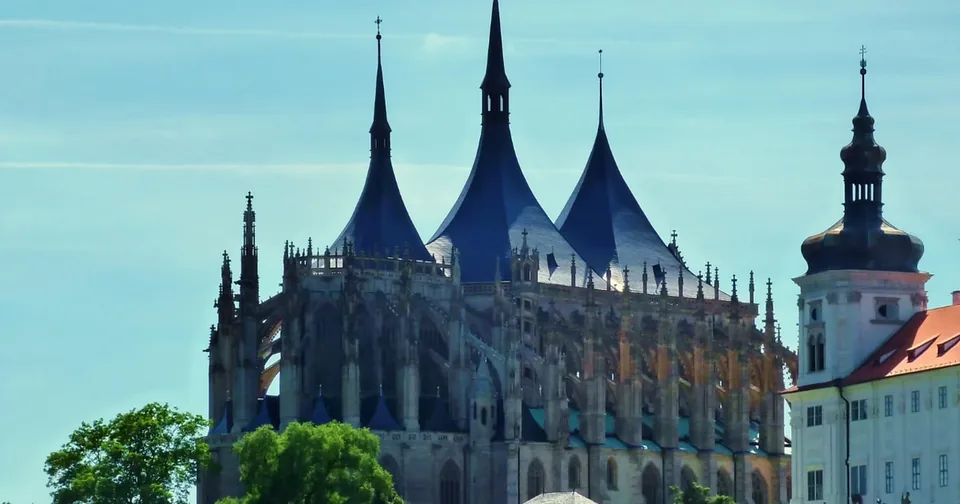 The tent-shaped spires of St Barbara's Cathedral above the town